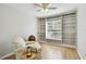 Comfortable room with wood floors, ceiling fan, and built-in bookshelves at 1486 Loman Ct, Palm Harbor, FL 34683
