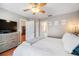 This beautiful bedroom has a closet and bathroom nearby, as well as a TV for your enjoyment at 1486 Loman Ct, Palm Harbor, FL 34683