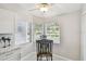 Bright breakfast nook with tiled floors, breakfast table and outside views at 1486 Loman Ct, Palm Harbor, FL 34683