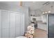 Well-lit kitchen features modern white cabinets, stainless steel appliances, and a bright eating nook at 1486 Loman Ct, Palm Harbor, FL 34683