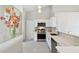 Stylish kitchen with stainless steel appliances, modern countertops, and backsplash at 1486 Loman Ct, Palm Harbor, FL 34683