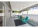 View of a screened lanai equipped with a hammock and seating area, perfect for enjoying the outdoors at 1486 Loman Ct, Palm Harbor, FL 34683