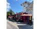 A fun, casual scene with Kane's Lemonade stand, made from a train car, plus umbrellas and seating at 1486 Loman Ct, Palm Harbor, FL 34683