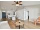 Spacious living area with modern flooring, light walls, and a contemporary ceiling fan at 1486 Loman Ct, Palm Harbor, FL 34683