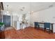 Spacious living area featuring wood flooring, modern lighting, and an open floor plan ideal for entertaining guests at 1486 Loman Ct, Palm Harbor, FL 34683