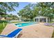 Sparkling pool and cabana area, perfect for outdoor entertaining and relaxation near lush trees at 1486 Loman Ct, Palm Harbor, FL 34683