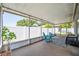 Inviting screened-in porch is furnished with stylish seating and offers a relaxing outdoor space at 1486 Loman Ct, Palm Harbor, FL 34683