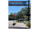 Downtown Dunedin street featuring a railroad crossing, Independence Day banner, and stop sign with crosswalk at 1486 Loman Ct, Palm Harbor, FL 34683