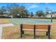 Basketball court with an inviting bench, perfect for enjoying the outdoors and community sports at 15038 Sterling Run, Brooksville, FL 34609