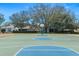Community basketball court perfect for Gathering games and recreational activities, framed by mature trees and nearby homes at 15038 Sterling Run, Brooksville, FL 34609