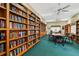 Community library with bookshelves, reading tables, and comfortable chairs at 15038 Sterling Run, Brooksville, FL 34609