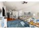 Spacious open-concept living room with hardwood floors, a leather sofa, and a dining area at 15038 Sterling Run, Brooksville, FL 34609