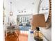 Open concept living and dining area with hardwood floors, nice furniture and decorative lighting at 15038 Sterling Run, Brooksville, FL 34609