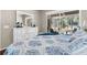 Bright main bedroom shows the screened-in patio doors and the view beyond at 15038 Sterling Run, Brooksville, FL 34609