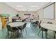 Spacious meeting room with tables, chairs, and projector screen at 15038 Sterling Run, Brooksville, FL 34609