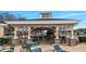 Outdoor seating area with tables and chairs under a covered gazebo structure at 15038 Sterling Run, Brooksville, FL 34609