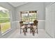 Cozy breakfast nook with bright windows and seating for two at 1723 Cortleigh Dr, Trinity, FL 34655