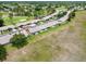Expansive aerial view of residences along the golf course with manicured lawns and lush landscaping in a desirable community at 18418 Bent Pine Dr, Hudson, FL 34667