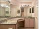 Bathroom with vanity and granite countertop at 18418 Bent Pine Dr, Hudson, FL 34667