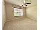 Bedroom featuring a window, a ceiling fan, neutral paint, and carpet flooring at 18418 Bent Pine Dr, Hudson, FL 34667
