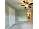 Spacious bedroom featuring a ceiling fan, neutral paint, and ample natural light at 18418 Bent Pine Dr, Hudson, FL 34667