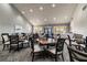Spacious dining room featuring ample seating, natural light, and neutral décor for an inviting atmosphere at 18418 Bent Pine Dr, Hudson, FL 34667