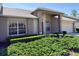 Beautiful home exterior showing the front yard with lush landscaping and a well-manicured lawn at 18418 Bent Pine Dr, Hudson, FL 34667