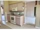 Kitchen showcasing essential appliances, counter space, and a seamless transition to adjacent areas at 18418 Bent Pine Dr, Hudson, FL 34667