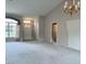 Spacious living area featuring neutral paint, lots of light, and high ceilings at 18418 Bent Pine Dr, Hudson, FL 34667