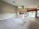 Open living area featuring natural light and view of the kitchen and dining room at 18418 Bent Pine Dr, Hudson, FL 34667