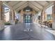 Grand entrance to the community clubhouse with an intricate logo on the floor and elegant architectural details at 18418 Bent Pine Dr, Hudson, FL 34667