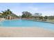 This pool features a large pool with lounge chairs for relaxation and a pool house at 18418 Bent Pine Dr, Hudson, FL 34667