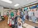 Golf pro shop with apparel and accessories displayed on racks and shelves, and golf bags on display at 18418 Bent Pine Dr, Hudson, FL 34667