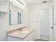 Bright bathroom featuring modern vanity, mirror, and good lighting at 18633 Oak Way Dr, Hudson, FL 34667
