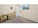 Cozy bedroom with tropical-themed dresser and decor, open doorway, creating a calm living space at 18633 Oak Way Dr, Hudson, FL 34667