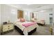 Cozy bedroom featuring plush carpet, mirrored closet, and warm accent lighting at 18633 Oak Way Dr, Hudson, FL 34667