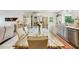 Bright dining area that opens into a stylish stainless kitchen and a modern living room at 18633 Oak Way Dr, Hudson, FL 34667