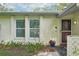 Close-up of the entrance with well-maintained landscaping and a clear view of the front door at 18633 Oak Way Dr, Hudson, FL 34667