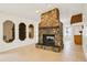 Unique stone fireplace adds charm to this bright living space at 18633 Oak Way Dr, Hudson, FL 34667
