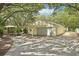 Garage and parking area with additional carport and foliage at 18633 Oak Way Dr, Hudson, FL 34667