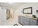 Bright kitchen features tile flooring, ample storage, and stylish countertop, plus backyard access and shelving at 18633 Oak Way Dr, Hudson, FL 34667