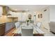Bright eat-in kitchen with sleek cabinetry, stainless steel appliances, and a stunning marble table perfect for gatherings at 18633 Oak Way Dr, Hudson, FL 34667