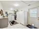 Well-equipped laundry room features modern appliances, ample storage, and direct access to the outdoors at 18633 Oak Way Dr, Hudson, FL 34667