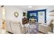Comfortable living room with an accent wall, plush seating, decorative rug and modern furnishings at 18633 Oak Way Dr, Hudson, FL 34667