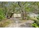 This outbuilding or shed provides ample storage space and functionality in the backyard at 18633 Oak Way Dr, Hudson, FL 34667