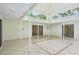 A covered patio with neutral tile flooring and windows that look out to the backyard at 18633 Oak Way Dr, Hudson, FL 34667