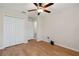Bright bedroom with hardwood floors and a closet, designed for restful comfort at 18710 Dobson Dr, Hudson, FL 34667