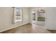 Bedroom featuring tile floors, bright window, and sliding glass door to the lanai at 18710 Dobson Dr, Hudson, FL 34667