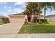 Charming single-story home with a well-manicured lawn and a two-car garage at 18710 Dobson Dr, Hudson, FL 34667