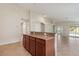 Stylish kitchen island with granite countertop perfect for food prep and entertaining at 18710 Dobson Dr, Hudson, FL 34667